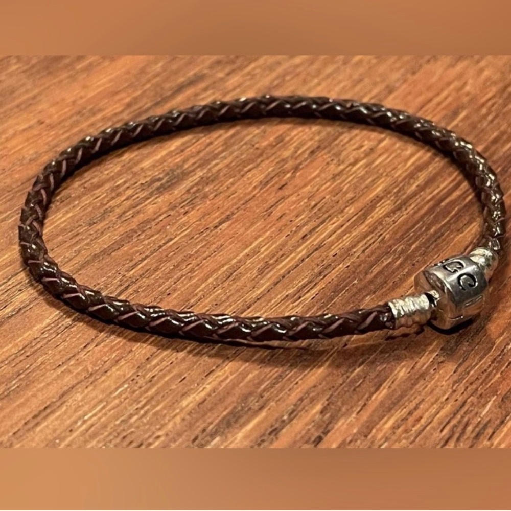 Brown braided leather charm bracelet. New.Sterling Silver clasp.